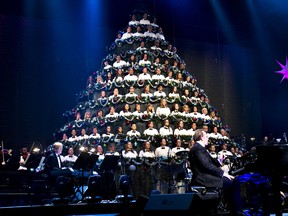 The Singing Christmas Tree choir takes the stage during a rehearsal in this file photo. This year's edition runs Dec. 14-17.