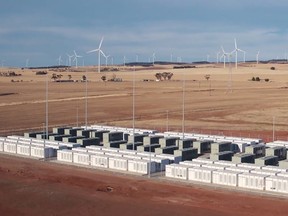 This screen grab from an undated handout video from a drone received by AFP on December 1, 2017 from French energy firm Neoen shows the Tesla 100 MW/129 MWh Powerpack system by billionaire entrepreneur Elon Musk in the rural town of Jamestown, 200km north of Adelaide.  The world's biggest battery was officially launched in Australia on December 1, with the Elon Musk-driven project powered up early to meet peak demand amid a bout of hot weather, officials said. / AFP PHOTO / Neoen