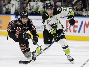 The Edmonton Oil Kings' Colton Kehler (23) battles the Calgary Hitmen's Riley Stotts (18) during first period WHL action at Rogers Place in Edmonton Monday, Jan. 1, 2018. Kehler scored two goals in an 8-2 loss, on the road, against the Moose Jaw Warriors on Friday.