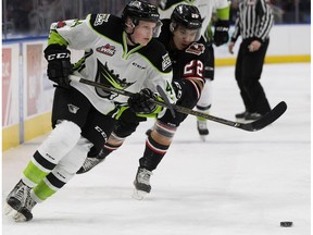 The Edmonton Oil Kings' Carter Souch (44) battles the Calgary Hitmen's Justyn Gurney (22) during first period WHL action at Rogers Place in Edmonton Monday, Jan. 1, 2018. Souch scored his first WHL goal in a 9-1 loss, on the road, against the Swift Current Broncos.