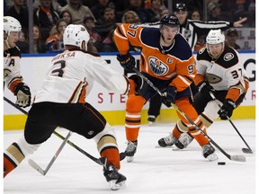 Edmonton Oilers captain Connor McDavid (97) comes up against Anaheim Ducks Cam Fowler (4), Kevin Bieksa (3) and Nick Ritchie (37) at Rogers Place in Edmonton on Thursday, Jan. 4, 2018. (David Bloom)