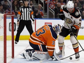 Edmonton Oilers goalie Cam Talbot (33) makes a save against the Anaheim Ducks' Cam Fowler (4) at Rogers Place in Edmonton on Thursday, Jan. 4, 2018. (David Bloom)