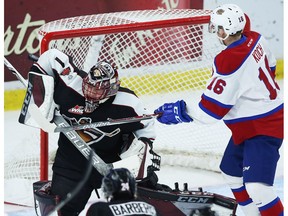 Goaltender Todd Scott #1 of the Vancouver Giants makes a save against Davis Koch #16 of the Edmonton Oil Kings during the first period of their WHL game at the Langley Events Centre on November 12, 2017 in Langley, British Columbia, Canada.