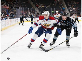 Davis Murray (14) of the Edmonton Oil Kings is pursued by Loeden Schaufler (3) of the Kootenay Ice during a previous meeting between the two clubs at Rogers Place in Edmonton on Dec. 30, 2017. (File)