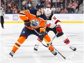 Connor McDavid #97 of the Edmonton Oilers is pursued by Drew Stafford #18 of the New Jersey Devils at Rogers Place in Edmonton on Friday, Nov. 3, 2017. (Codie McLachlan/Postmedia) Photos for copy in Saturday, Nov. 4 edition.