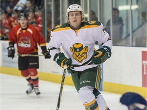 Jamie Crooks of the University of Alberta Golden Bears plays against the University of Calgary Dinos at Clare Drake Arena in Edmonton on January 11, 2018.