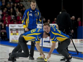 Team Alberta skip Brendan Bottcher,lead Karrick Martin.second Bradley Thiessen follow the stone during his opening round loss to hometown' Brad Gushue of N.L.