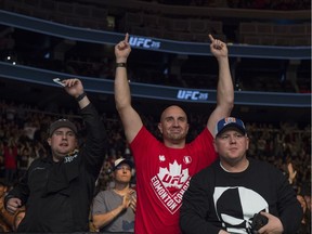UFC fans watch Rick Glenn defeat Gavin Tucker in a featherweight bout during UFC 215 at Rogers Place in Edmonton on Sept. 9, 2017.