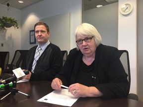 City of Edmonton city manager Linda Cochrane (right) and Wade King address members of the media on Jan. 11, 2018.  Edmonton officials seconded the University of Alberta's Wade King for a year to help them address issues of harassment in the workplace.