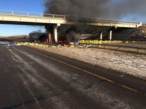 Leduc RCMP respond to the scene of a collision on the Queen Elizabeth II highway at the Millet overpass after a semi-truck struck the support structure for the Highway 616 overpass and caught fire. (RCMP handout photo)