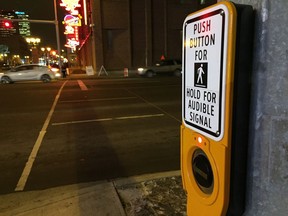 An actuated traffic signal for 104 Avenue at 104 Street near Rogers Place. Push the button to get a walk light.
