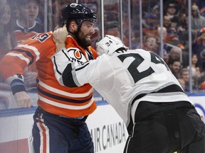 Los Angeles Kings' Derek Forbort (24) and Edmonton Oilers' Patrick Maroon (19) fight during second period NHL action in Edmonton, Alta., on Tuesday January 2, 2018.