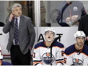Edmonton Oilers head coach Todd McLellan, left, watches his team play against the Chicago Blackhawks on Sunday, Jan. 7, 2018, in Chicago.