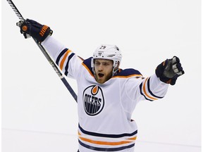 Edmonton Oilers forward Leon Draisaitl celebrates a goal by defenceman Darnell Nurse against the Arizona Coyotes, during the third period of an NHL hockey game on Jan. 12, 2018, in Glendale, Ariz.