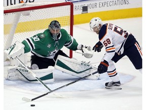 Edmonton Oilers forward Anton Slepyshev gets in on Dallas Stars goaltender Ben Bishop in Dallas on Saturday, Jan. 6, 2018.