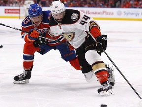 Anaheim Ducks centre Nate Thompson (44) protects the puck from Edmonton Oilers defenceman Matthew Benning (83) in the second round of the 2017 NHL Playoffs in Edmonton on Wednesday, May 3, 2017.