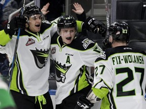 The Edmonton Oil Kings celebrate Davis Koch's (16) game winning goal against the Calgary Hitmen during third period WHL action at Rogers Place in Edmonton Monday, Jan. 1, 2018.