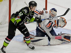 Kamloops Blazers goalie Max Palaga (right) makes a save on Edmonton Oil Kings Liam Keeler (left) during WHL game action in Edmonton on Sunday January 21, 2018.