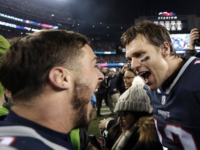 Patriots wide receiver Danny Amendola, left, and quarterback Tom Brady celebrate their victory over the Jaguars in the NFL's AFC Championship Game, in Foxborough, Mass., on Sunday, Jan. 21, 2018.