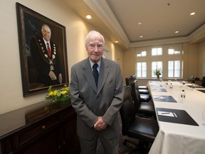 File photo - Former Edmonton Mayor Terry Cavanagh poses for a photo in the newly renamed Cavanagh Room at the Fairmont Hotel Macdonald, in Edmonton, Alta. on Wednesday May 13, 2015.