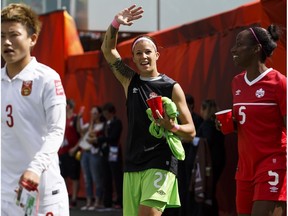 Canada goalkeeper Stephanie Labbé (21) waves beside Robyn Gayle (5) as China Pang Fengyue (3) enter for the opening ceremonies of a FIFA Women's World Cup 2015 match between Canada and China at Commonwealth Stadium in Edmonton, Alta., on Saturday June 6, 2015. Ian Kucerak/Edmonton Sun/Postmedia Network
