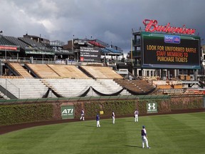 In this May 11, 2015, file photo, construction continues on the right field bleachers at Wrigley Field before a baseball game between the Chicago Cubs and New York Mets in Chicago. (AP Photo/Charles Rex Arbogast, File)