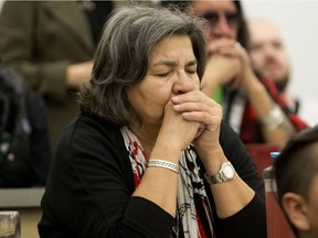 Attendees listen to a prayer song prior to the start of an educational forum titled Canadian colonialism and the law: The case of Colten Boushie, at MacEwan University, Tuesday Feb. 13, 2018.