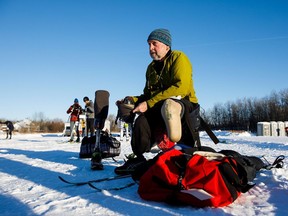 Double amputee Jacob Wouters prepares his sit ski during the Canadian Birkebeiner cross country ski race beginning at the Ukrainian Cultural Heritage Village on Saturday, Feb. 10, 2018.