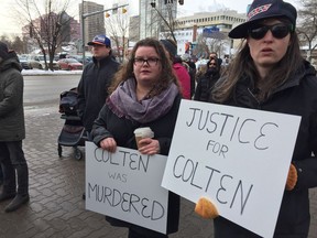 Participants at a rally Saturday outside Edmonton's downtown police headquarters protesting the verdict in the trial of Saskatchewan farmer Gerald Stanley, who was found not guilty of Colten Boushie's second-degree murder.