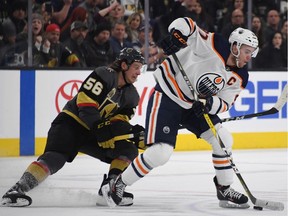 Edmonton Oilers captain Connor McDavid skates against Erik Haula of the Vegas Golden Knights at T-Mobile Arena on Jan. 13, 2018, in Las Vegas. The Oilers won 3-2 in overtime.
