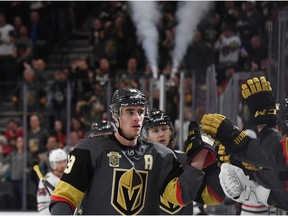 Reilly Smith of the Vegas Golden Knights celebrates with teammates after scoring against the Chicago Blackhawks at T-Mobile Arena on Monday, Feb. 13, 2018, in Las Vegas. The Golden Knights won 5-2.