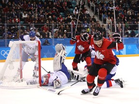 Gilbert Brule celebrates after scoring Canada's fourth goal against South Korea goaltender Matt Dalton on Feb. 18, 2018.