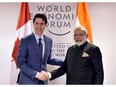 In this photograph released by the Indian Press Information Department on Jan. 23, 2018, Indian Prime Minister Narendra Modi (R) shakes hands with Prime Minister Justin Trudeau at the World Economic Forum in Davos. (HANDOUT/AFP/Getty Images)