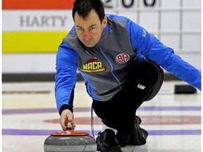 Skip Mike Hutchings delivers a rock at the 2018 Boston Pizza Cup Alberta championships in Spruce Grove on Wednesday, Jan. 31, 2018.
