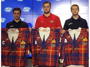 Edmonton Oil Kings Colton Kehler, left, Thomas Soustal, and Conner McDonald display the Don Cherry-themed jersey's they will wear against the Calgary Hitmen in their WHL game on Friday, March 2, 2018. (Derek Van Diest)