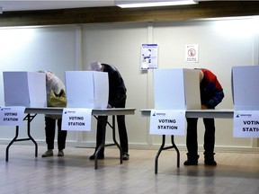 Voters cast ballots in a municipal election.