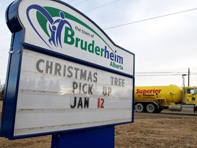 A fuel truck passes one of Bruderheim's town signs on Jan. 11, 2012.
