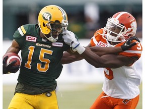 B.C. Lions defensive back Buddy Jackson (3) grabs the face mask of Edmonton Eskimos wide receiver Vidal Hazelton (15) during first half CFL action in Edmonton, Alta., on Friday July 28, 2017.