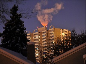 A 2012 photo of Strathcona House. The highly visible condo building's combination of rooftop steam and lighting makes it a relatively regular source of false alarm calls to Edmonton fire. Fire officials say people often call 911 in winter, thinking the building is on fire (it's really just the red aircraft lights and building exhaust on the roof).