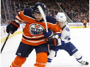 Tampa Bay Lightning's Vladislav Namestnikov (90) and Edmonton Oilers' Andrej Sekera (2) battle for the puck in Edmonton on Monday, Feb. 5, 2018.