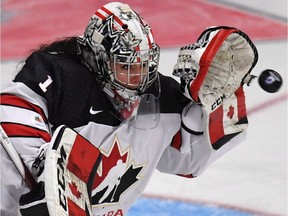 Team Canada goalie Shannon Szabados makes a glove save during Women's World Hockey Championship action against the United States in Plymouth, Mich., on March 31, 2017.