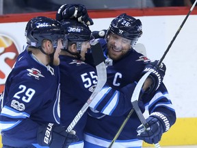 Mark Scheifele was back between his old linemates, Patrik Laine (left), and Blake Wheeler, at Jets practice on Wednesday. (Kevin King/Winnipeg Sun)