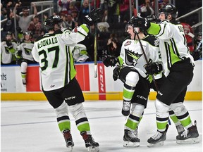 Edmonton Oil Kings Trey Fix-Wolansky (centre) celebrates his winning goal with 7.6 seconds left in the game with Conner McDonald (37) and Tomas Soustal (11), against the Red Deer Rebels during WHL action at Rogers Place in Edmonton, February 10, 2018.