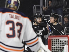 Los Angeles Kings left wing Adrian Kempe, right, of Sweden, celebrates his goal with defenseman Drew Doughty, center, as Edmonton Oilers goaltender Cam Talbot stands near the net during the second period of an NHL hockey game Wednesday, Feb. 7, 2018, in Los Angeles.
