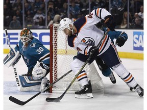 Edmonton Oilers right wing Zack Kassian (44) tries to score against San Jose Sharks goaltender Aaron Dell (30) during the first period of an NHL hockey game Saturday, Feb. 10, 2018, in San Jose, Calif.