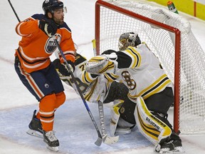 Edmonton Oilers forward Patrick Maroon (left) skates in on Boston Bruins goalie Anton Khudobin during first period NHL game action in Edmonton on Tuesday February 20, 2018.