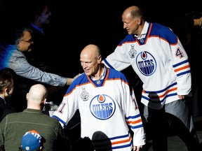 Mark Messier, left, and Kevin Lowe greet fans during the NHL's Greatest Team celebration recognizing the 1984-85 Edmonton Oilers team at Rogers Place in Edmonton on Sunday, Feb. 11, 2018.