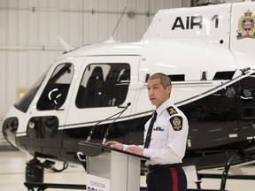 Acting police chief Greg Preston, stands in front of the new state-of -the –art Air 1 helicopter. Equipped with the latest technology the $5.9 million helicopter will help the Edmonton Police Service fight crime more efficiently and safely . The Airbus H-125 is one of the best helicopters in service, and is used by over 200 law enforcement agencies in the world.Taken on Friday, Feb. 23, 2018  in Edmonton. Greg  Southam / Postmedia