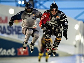 Canadian skater Scott Croxall (2) leads Russian skater Andrey Lavrov (20) during the Ice Cross Downhill World Championship season finale at Red Bull Crashed Ice in Edmonton on March 14, 2015.