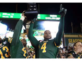 Edmonton Eskimos Odell Willis, left, and Adarius Bowman celebrate a win over the Calgary Stampeders in the CFL West Final at Commonwealth Stadium in Edmonton on Nov. 22, 2015. (File)